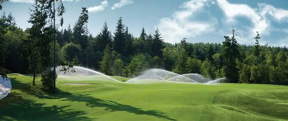 Sprinkler system watering a golf course in Clarklake, MI.