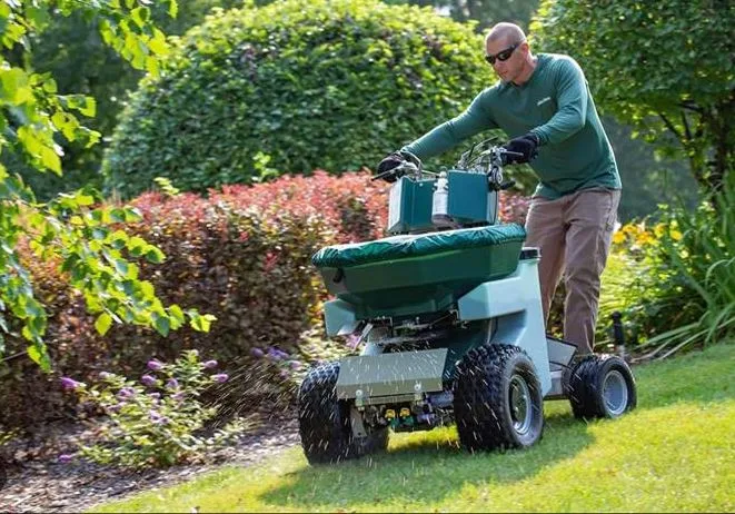Emerald Outdoor, LLC fertilizer spreader sitting in a lawn at a home in .